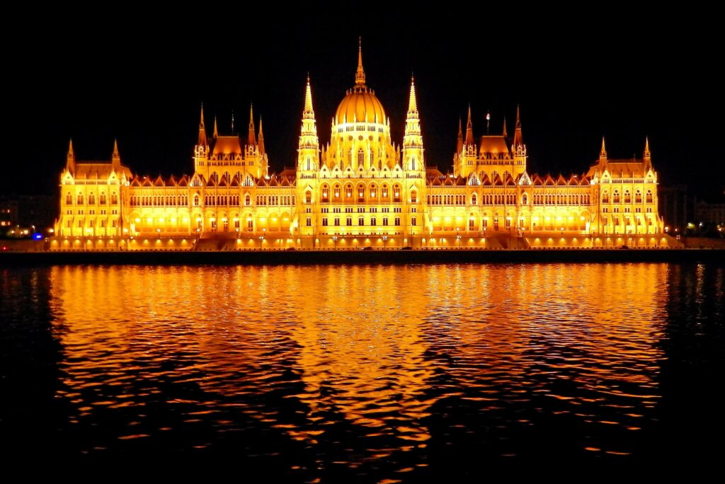 River cruise on the Danube to see majestic sights like the Parliament building in Budapest